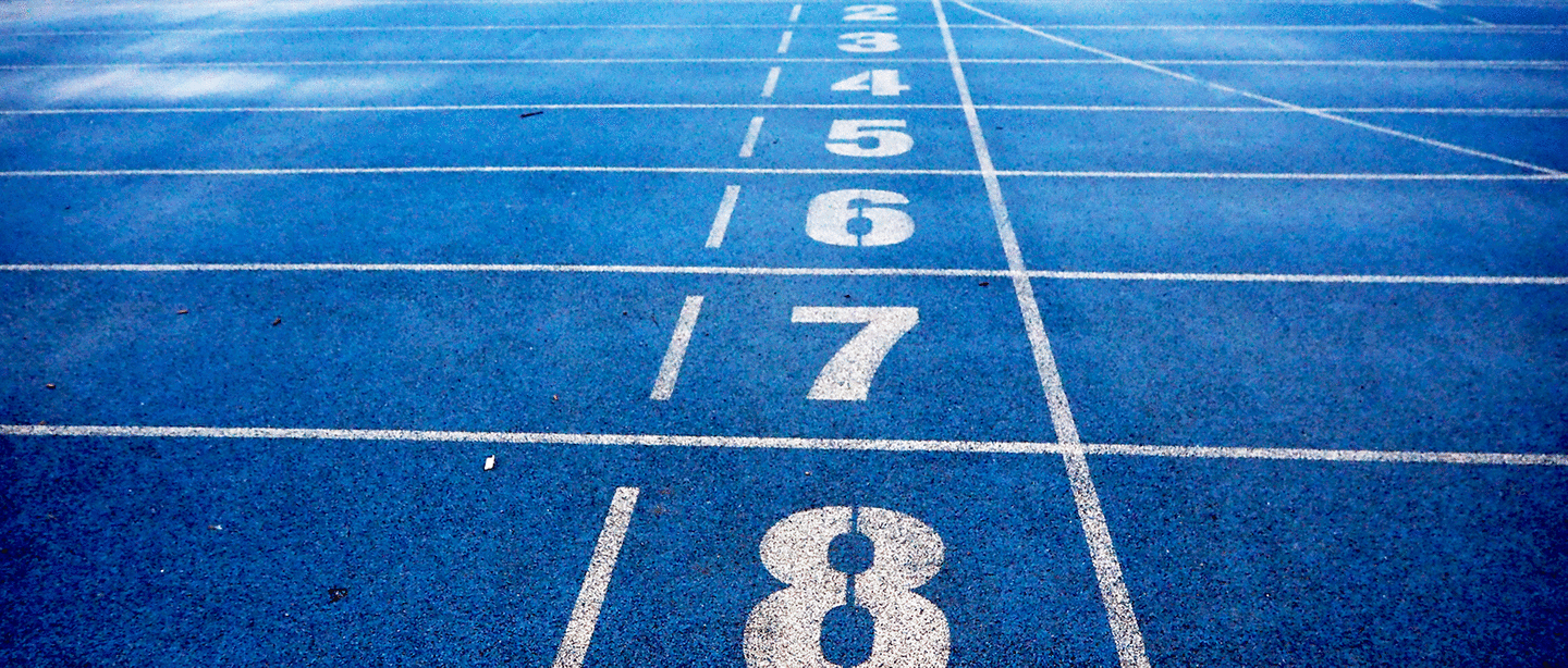 Performance track light blue painted field surface with white lines